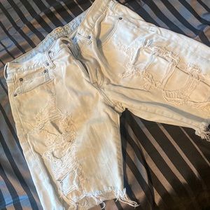 Mens light blue ripped jean shorts